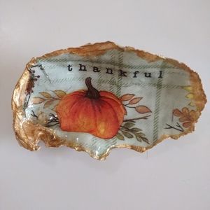 Pumpkin with thankful paper print decoupaged onto oyster shell and resin
